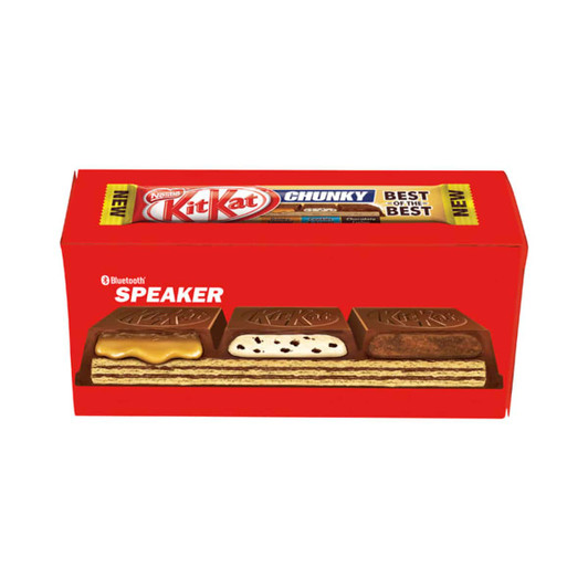 A customised box featuring a red design with a variety of Kit Kat Chunky chocolates and a Bluetooth speaker branding.