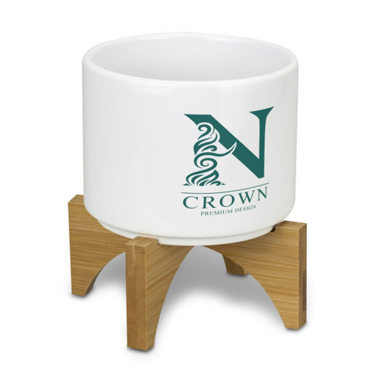 A white planter with a bamboo base, featuring a logo design.