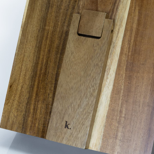 A wooden recipe book holder featuring a smooth finish and a branding logo, showcasing rich brown tones.