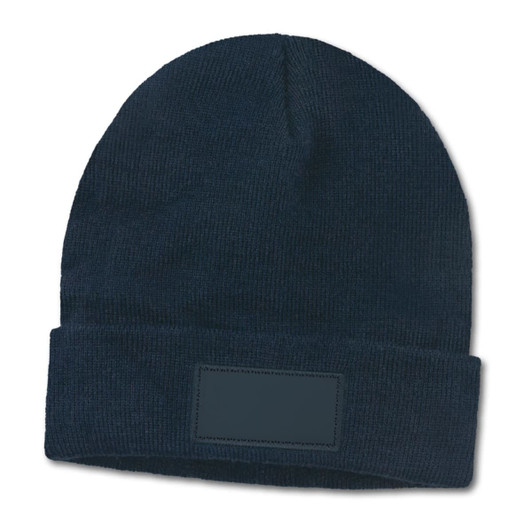 A navy blue beanie with a fold-up cuff and a blank patch for customization.