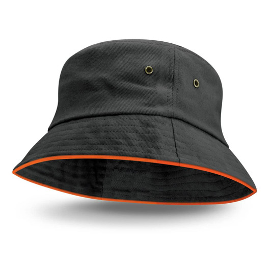 A black bucket hat with an orange sandwich trim and eyelet accents, featuring a branding logo.
