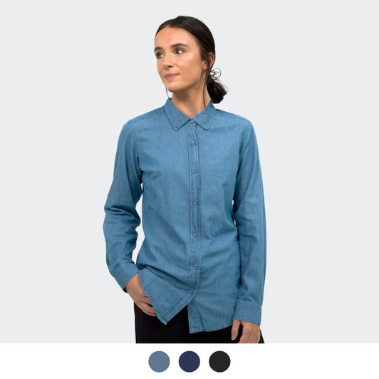 A women's denim button-up shirt in a light blue shade, featuring a collar and long sleeves, displayed on a model.
