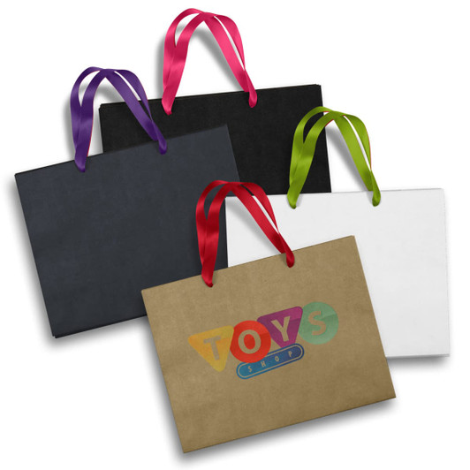 A collection of large paper bags in black, white, and brown, featuring vibrant ribbon handles in pink, purple, and green.