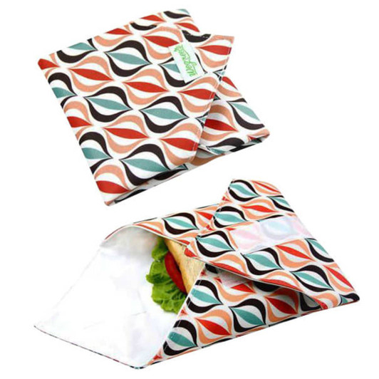 A reusable food wrap with a vibrant geometric pattern in coral, green, and black, featuring a logo.