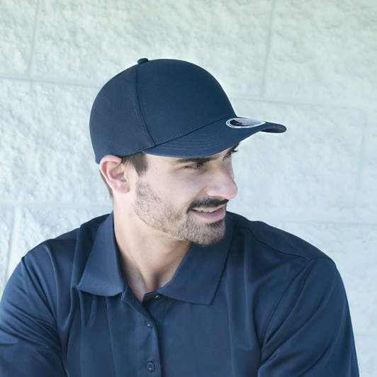 A navy blue cap with a curved brim, worn by a man. The cap features a logo on the side.