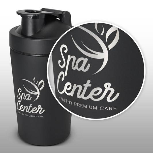 A black protein shaker with a secure lid, featuring a logo on the side and a sleek, matte finish.