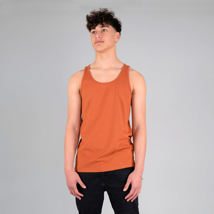 A rust-coloured adult singlet featuring a logo, displayed on a model against a neutral background.