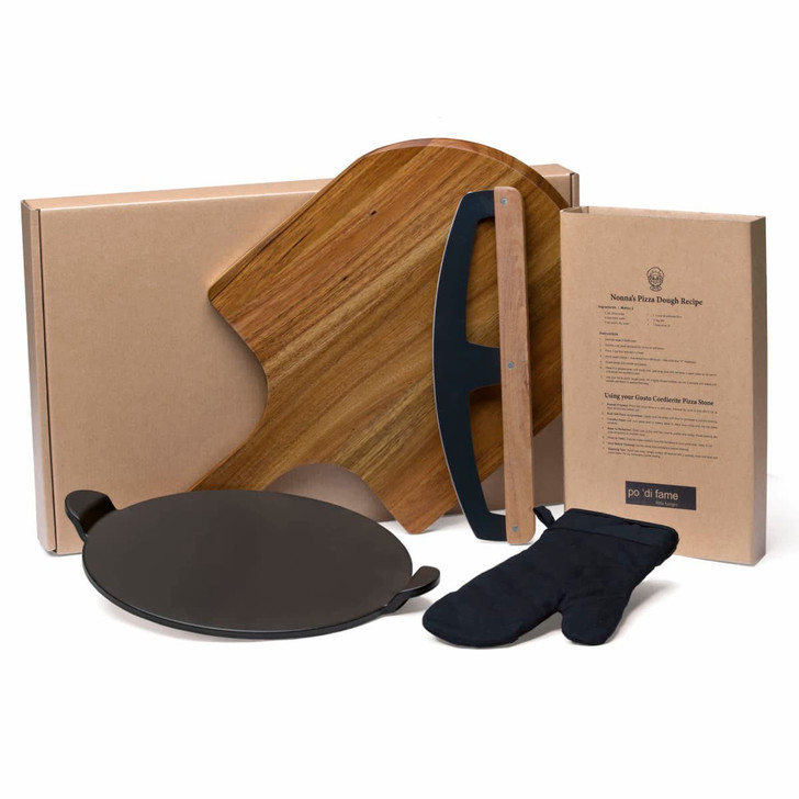 A pizza set featuring a wooden peel, a black baking stone, an oven mitt, and packaging in neutral tones.