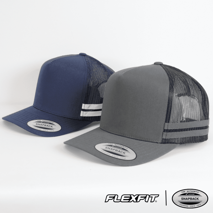 Two trucker caps in navy and grey, featuring mesh backs and a logo on the front.