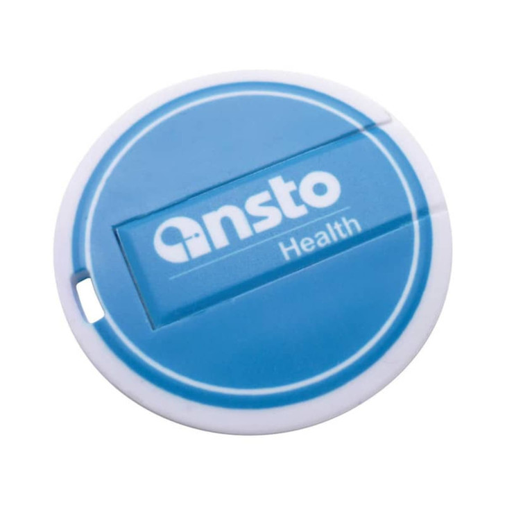A round, blue Flipper Flash Drive with a white border and a logo on the front.