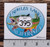 Oval sticker showing rainbow trout with 395 sign that says "Crowley Lake California"