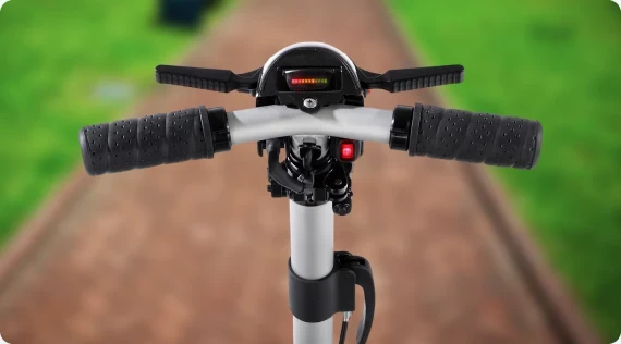 EP4 tiller with extended hand grips and the battery indicator over a garden path
