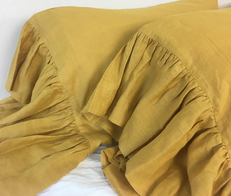 Gold pillowcases with long ruffles
