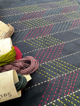 This sashiko placemat feature a traditional Japanese design and stitched in dark, moody tones, it makes a distinctive statement on your dining table. 

