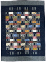 Image of an easy to make Japanese Artisan Quilt is a tribute to the stunning Takumi and textured woven fabrics from Japan. Takumi translates to artisan or master craftsman in English, and this quilt includes these traditional Kofu designs from Japan. Woven fabrics combine to add texture and warmth to this quick and easy quilt. Quilt designed by Jane MacDonald. It is also available as a complete kit. 