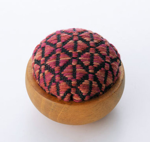 Kogin pincushion. Triangles in orange and pink. Timber base. 