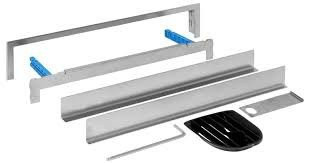 Geberit ready-to-fit set for wall drain, multi-piece, stainless steel, with black components.