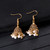 Ethnic Gold Jhumka Tassel Earrings – Pink Zircon