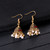 Ethnic Gold Jhumka Tassel Earrings – Pink Zircon