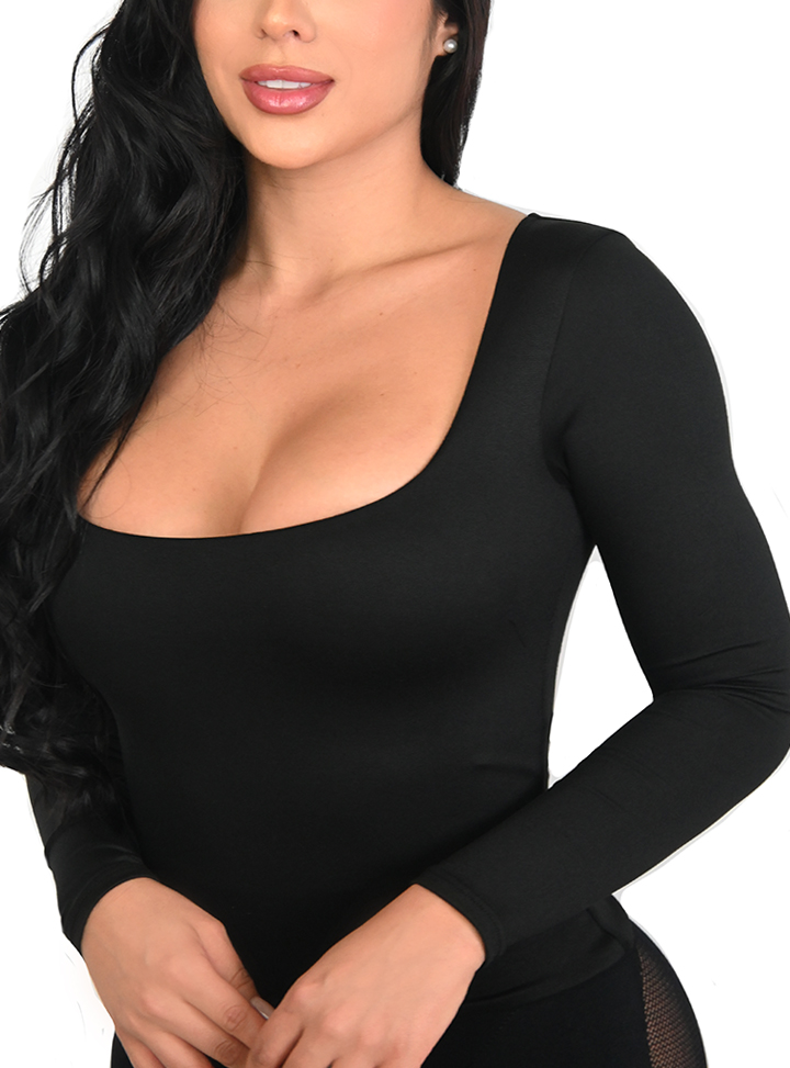 A model is leaning forward wearing the Essential Top Long Sleeve Scoop Neck in Black color.
