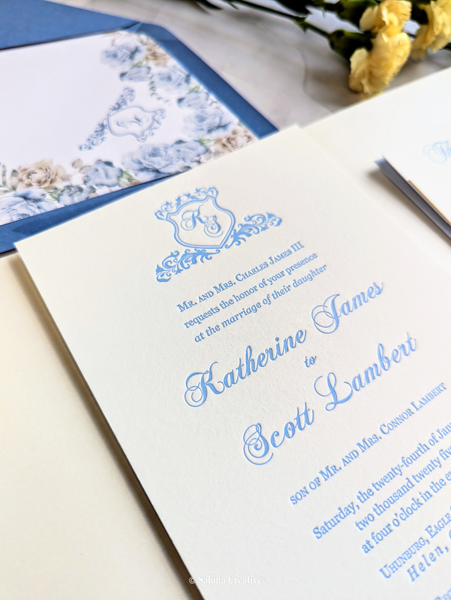 Letterpress monogram crest wedding invitations