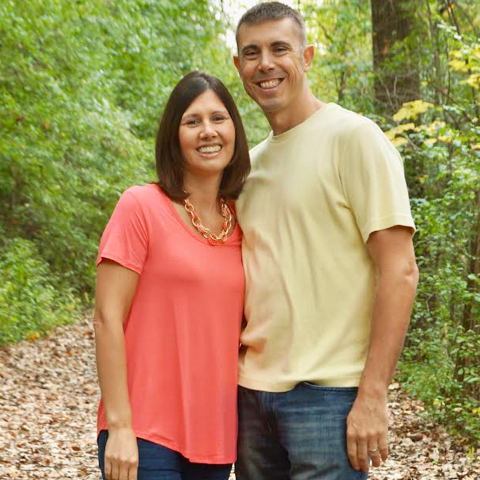 Gregory and Wendy standing in the front of city landscape