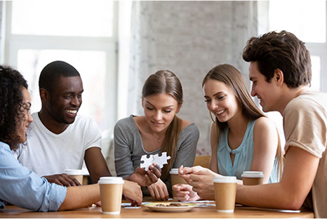Group playing with puzzle pieces