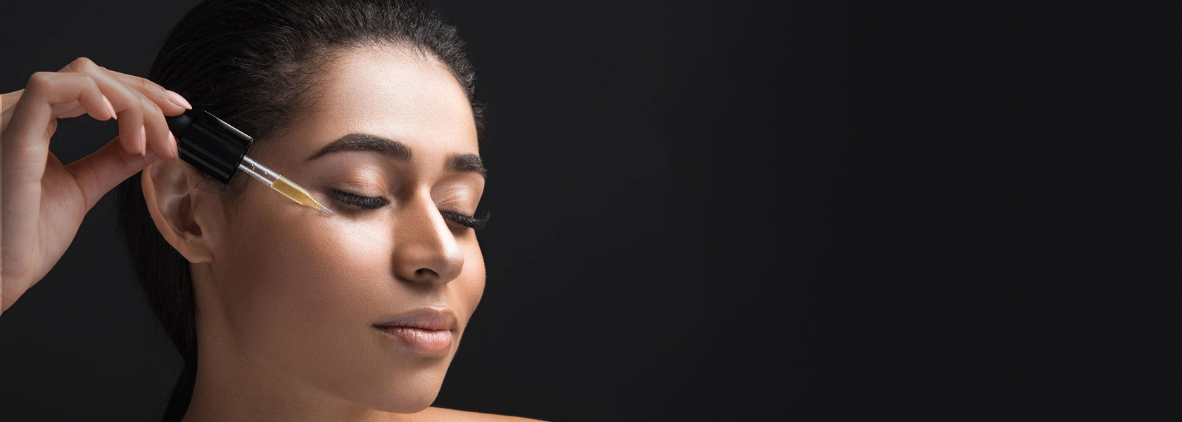 woman adding product to her face