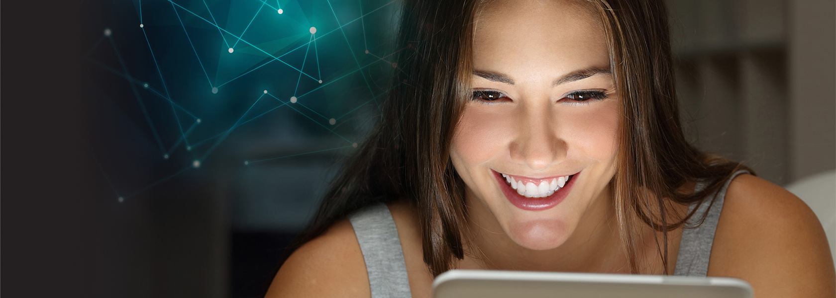 Smiling woman looking at tablet