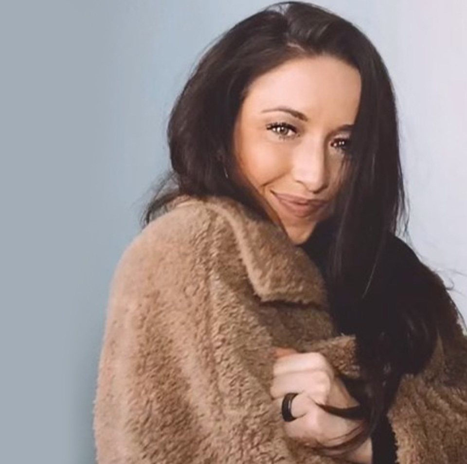 Emily Morrow in a brown jacket