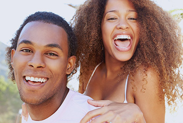Woman hugging man from behind