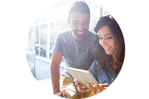 Man and woman looking at notebook