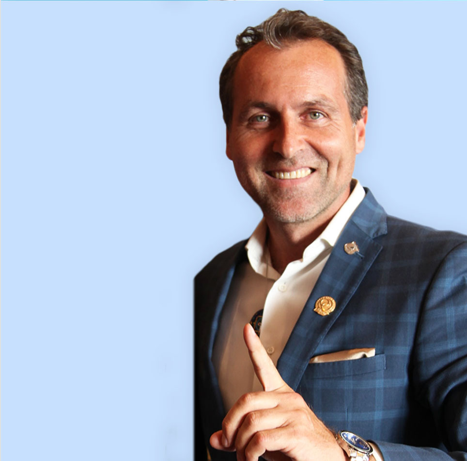 Szilveszter Gyulai in blue suite with blue grey background