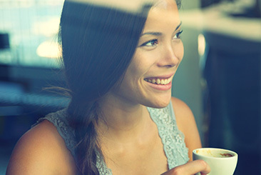 Woman drinking cup of coffee