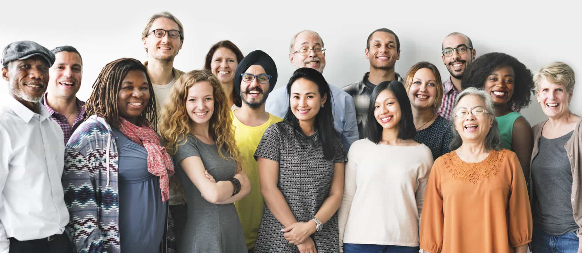 Group photo of Organo Gold team standing in front of white backdrop