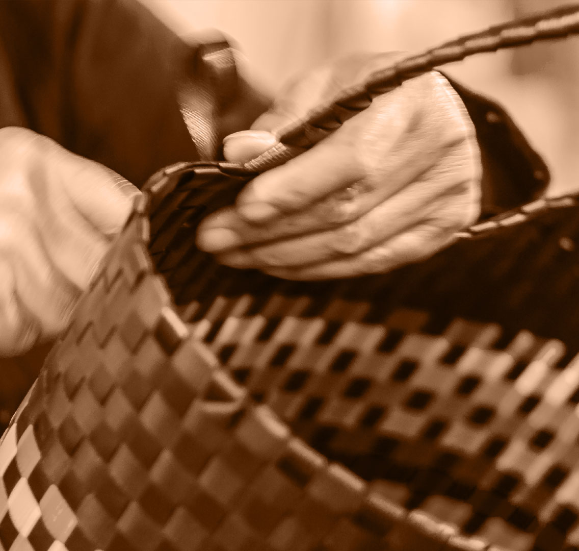 Worker putting assembling Organo Bags for Life bag.