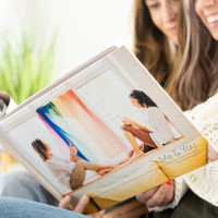 Gather an album of all your favorite pictures to create a hardcover photo book you simply won't want to put down