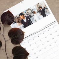 Celebrate newlyweds with a personalized photo calendar featuring their autumn wedding memories, making a thoughtful gift they’ll use all year