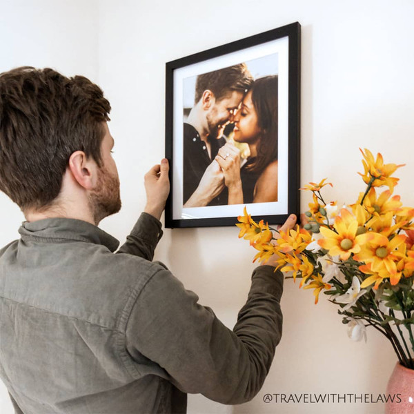 Bring your engagement photos to life in a framed print with a matte border like @travelwiththelaws on Instagram