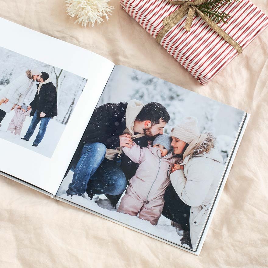 Capture the warmth of family time in winter with a personalized hardcover photo book filled with cozy memories