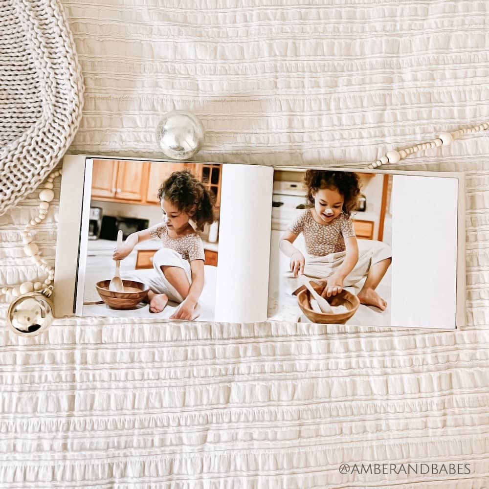 Craft a hardcover photo book of winter memories like @amberandbabes on Instagram