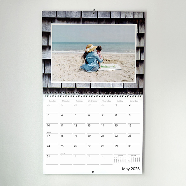 Wall calendar displaying a beach photo above a clean monthly layout.