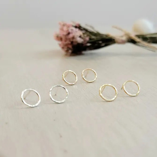 At 7mm across, these tiny circle studs are perfect for a minimalist look, with a hammered texture that adds depth and shine. Your new favourite set of studs! Available in sterling silver, 14k yellow gold filled, or 14k rose golf filled.  At 7mm across, these tiny circle studs are perfect for a minimalist look, with a hammered texture that adds depth and shine. Your new favourite set of studs! Available in sterling silver, 14k yellow gold filled, or 14k rose golf filled.