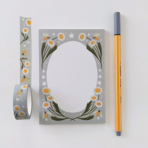 A simple tear-away notepad for jotting down to-do's, grocery lists, or whatever you need to remember. Illustrated with Julianna Swaney's hand painted whimsical decorative border of simple daisy flowers, bees and stars on a gray background. Measures 3 x 5 inches. 50 sheets of tear-away pages (not adhesive).  A simple tear-away notepad for jotting down to-do's, grocery lists, or whatever you need to remember. Illustrated with Julianna Swaney's hand painted whimsical decorative border of simple daisy flowers, bees and stars on a gray background. Measures 3 x 5 inches. 50 sheets of tear-away pages (not adhesive).