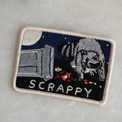 "Scrappy Raccoon" embroidered sticky patch by Stay Home Club.

