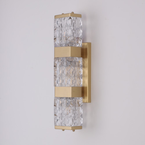 Brooklyn Crystal Block Brass Sconce shown mounted on a white wall, featuring a thick rectangular crystal block paired with brushed metal hardware for a sleek, modern look.