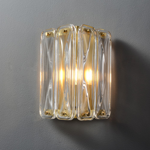Front view of an illuminated Fluted Glass Wall Sconce Single wall light, showing the vertically fluted glass shade supported by metal fixings, with light softly diffusing through the glass.