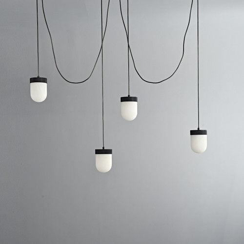 An unlit Erica Alabaster Cluster Pendant 4 Lights, viewed from the front, showing four capsule-shaped natural alabaster shades suspended at varying heights in a cluster.