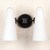 Front view of an unlit Bianco Double Sconce Bronze double wall light, emphasizing the shape and texture of the two milky white conical glass shades and the metal base and arms with a brushed bronze finish.