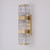 Brooklyn Crystal Block Brass Sconce shown mounted on a white wall, featuring a thick rectangular crystal block paired with brushed metal hardware for a sleek, modern look.